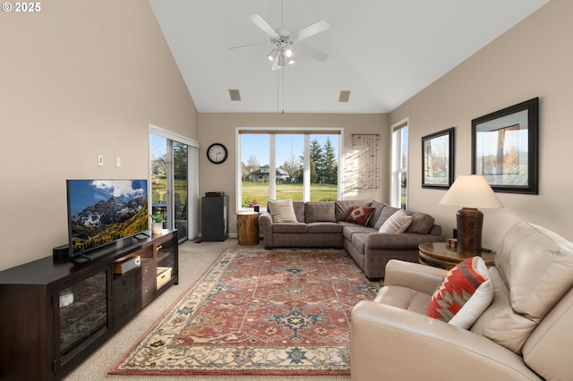 living area featuring a ceiling fan, light carpet, high vaulted ceiling, and visible vents