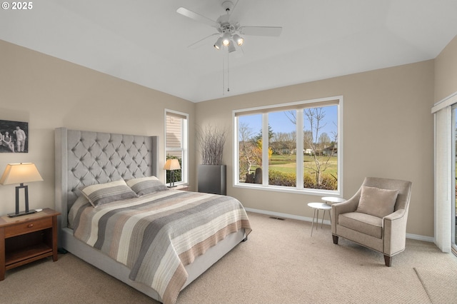 bedroom featuring light colored carpet, ceiling fan, visible vents, and baseboards