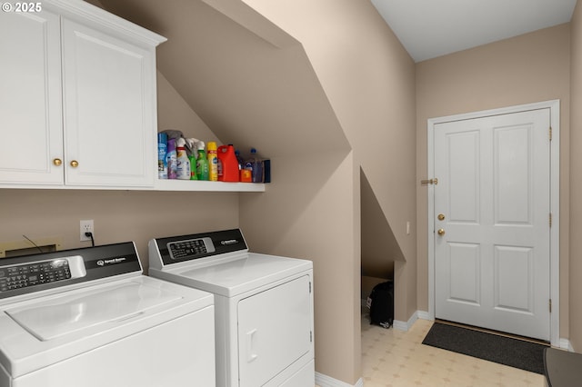 clothes washing area featuring light floors, separate washer and dryer, cabinet space, and baseboards