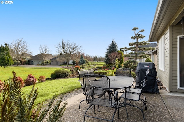 view of patio with outdoor dining area and area for grilling