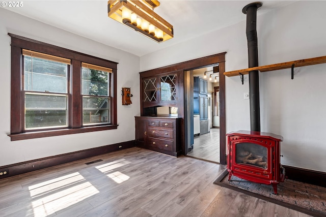 622 C St, Washougal, WA 98671 - unfurnished living room featuring a wood stove and wood finished floors