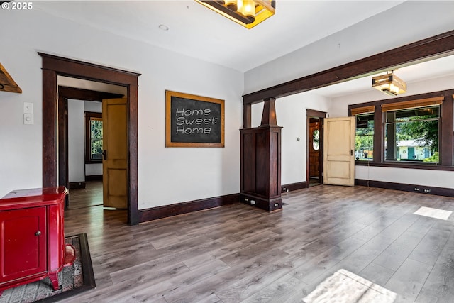 622 C St, Washougal, WA 98671 - unfurnished living room with plenty of natural light, a wood stove, and wood finished floors