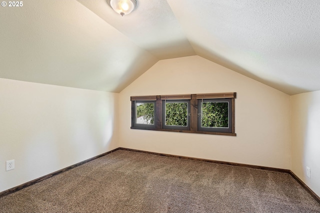 622 C St, Washougal, WA 98671 - bonus room with carpet flooring, vaulted ceiling, and a textured ceiling