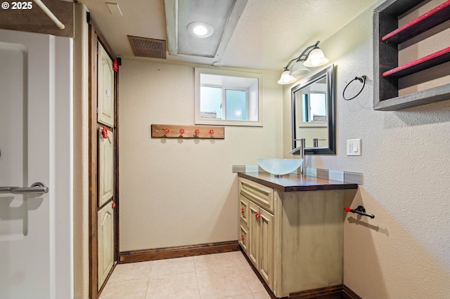 622 C St, Washougal, WA 98671 - bathroom with vanity, tile patterned floors, and a textured wall