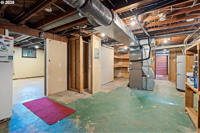 622 C St, Washougal, WA 98671 - below grade area featuring heating unit, fridge, and electric panel