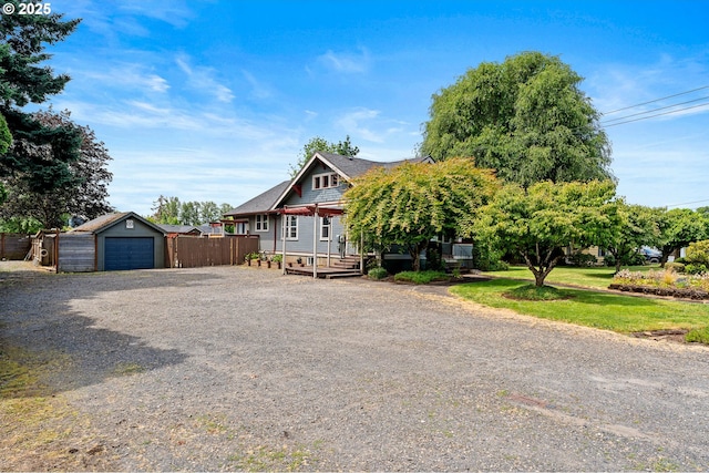 622 C St, Washougal, WA 98671 - view of front of property featuring a deck, an outdoor structure, and driveway