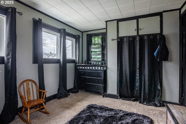 bedroom featuring carpet flooring and baseboards