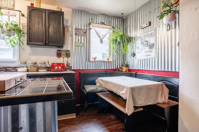 dining room with breakfast area and dark wood-style flooring