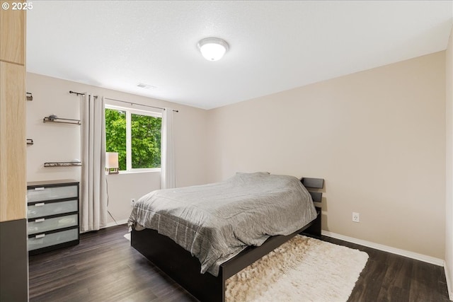 525 SW 207th Ave, Beaverton, OR 97006 - bedroom with dark wood-type flooring and baseboards