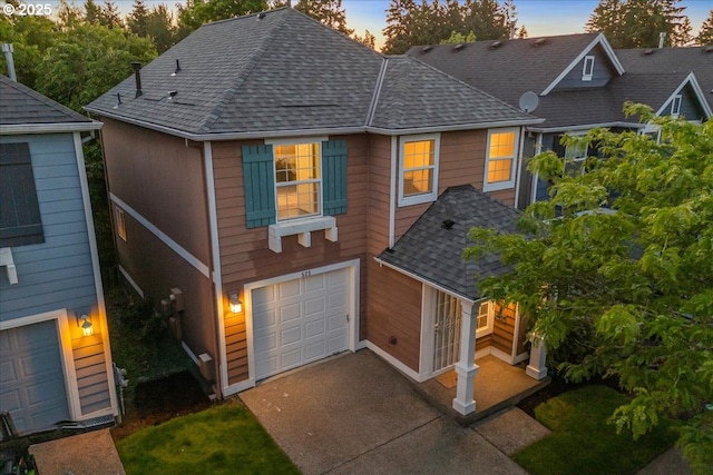 525 SW 207th Ave, Beaverton, OR 97006 - view of front of property featuring a shingled roof, an attached garage, and concrete driveway