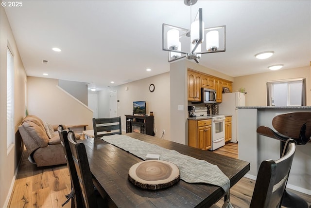 525 SW 207th Ave, Beaverton, OR 97006 - dining room featuring light wood-style flooring, baseboards, a chandelier, and recessed lighting