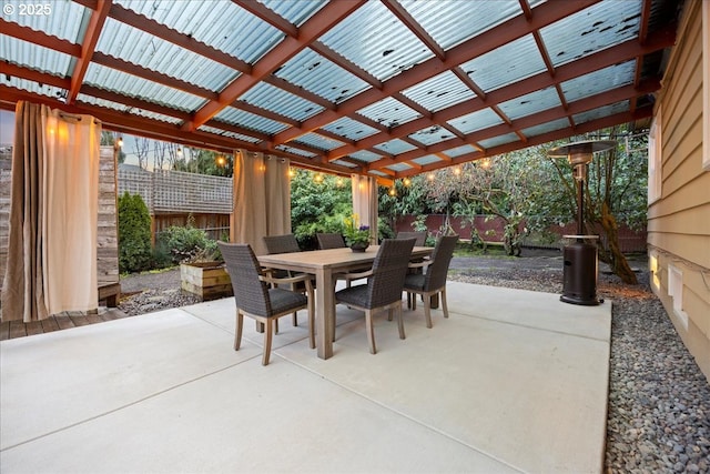 view of patio / terrace featuring outdoor dining space, a fenced backyard, and a pergola