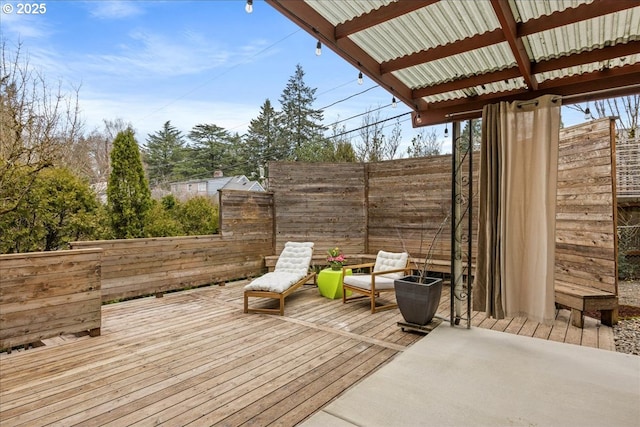 deck with a fenced backyard