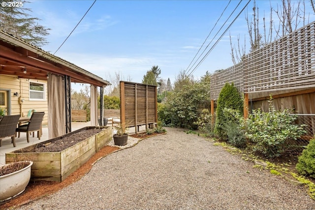 view of yard with a patio and fence