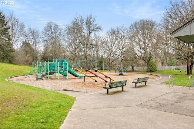 community playground with a lawn and fence