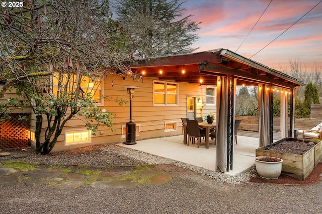 back of house with a patio