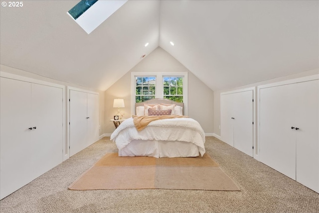 5932 NE 29th Ave, Portland, OR 97211 - carpeted bedroom with a skylight, lofted ceiling, and multiple closets