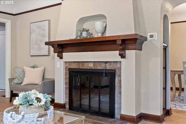 5932 NE 29th Ave, Portland, OR 97211 - detailed view of arched walkways, baseboards, a fireplace, and wood finished floors