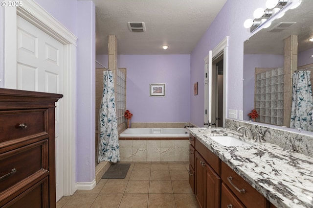 6783 Rogue River Dr, Shady Cove, OR 97539 - full bath featuring tile patterned flooring, tiled shower, vanity, a garden tub, and a textured ceiling
