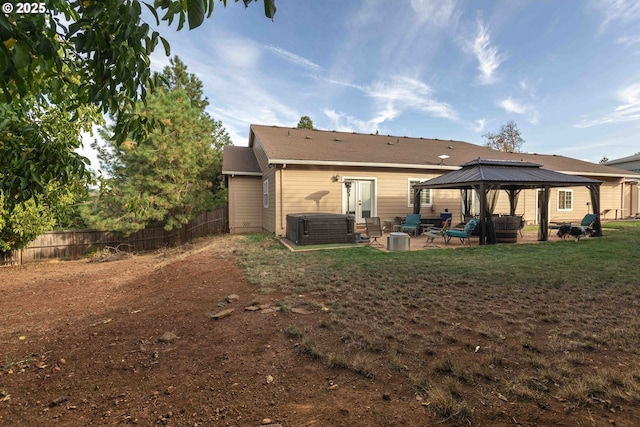 6783 Rogue River Dr, Shady Cove, OR 97539 - rear view of property with a gazebo, a patio, and a covered hot tub