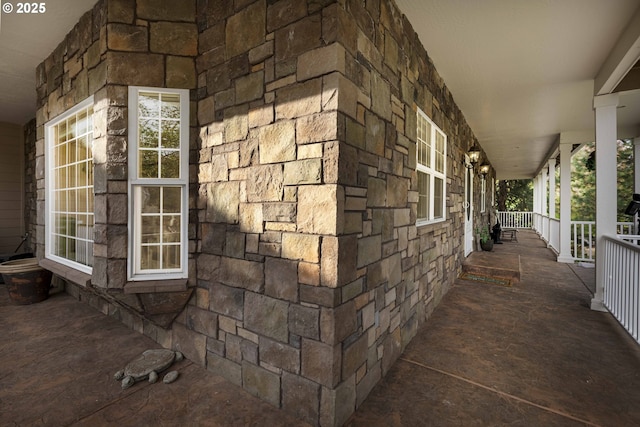 6783 Rogue River Dr, Shady Cove, OR 97539 - view of home's exterior with a porch and stone siding