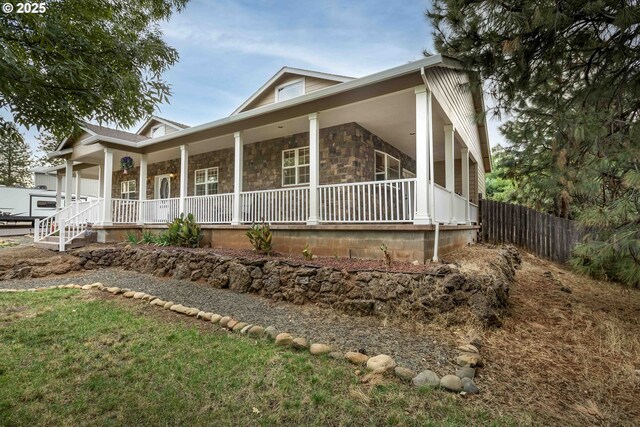 6783 Rogue River Dr, Shady Cove, OR 97539 - view of front of house featuring a porch and stone siding