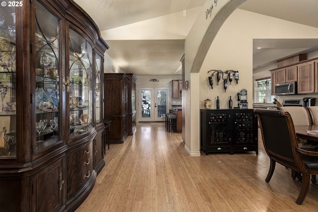6783 Rogue River Dr, Shady Cove, OR 97539 - office space featuring lofted ceiling, arched walkways, french doors, and light wood-style floors