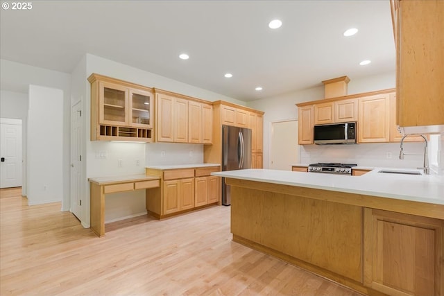 18169 SW Shady Meadow Ct, Beaverton, OR 97007 - kitchen featuring appliances with stainless steel finishes, a sink, light brown cabinetry, light countertops, and recessed lighting