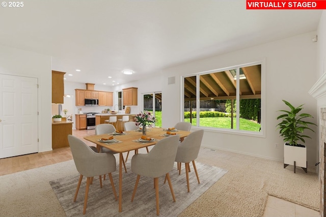 18169 SW Shady Meadow Ct, Beaverton, OR 97007 - dining space featuring light colored carpet, baseboards, and recessed lighting