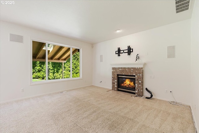 18169 SW Shady Meadow Ct, Beaverton, OR 97007 - unfurnished living room featuring carpet flooring, a fireplace, and baseboards