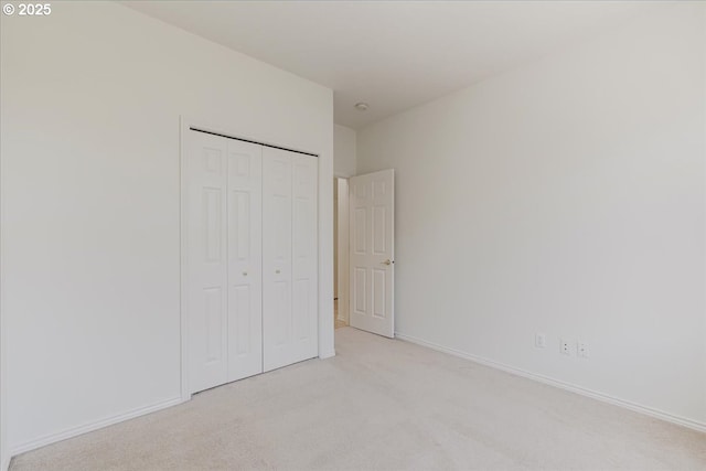 18169 SW Shady Meadow Ct, Beaverton, OR 97007 - unfurnished bedroom with light colored carpet, a closet, and baseboards
