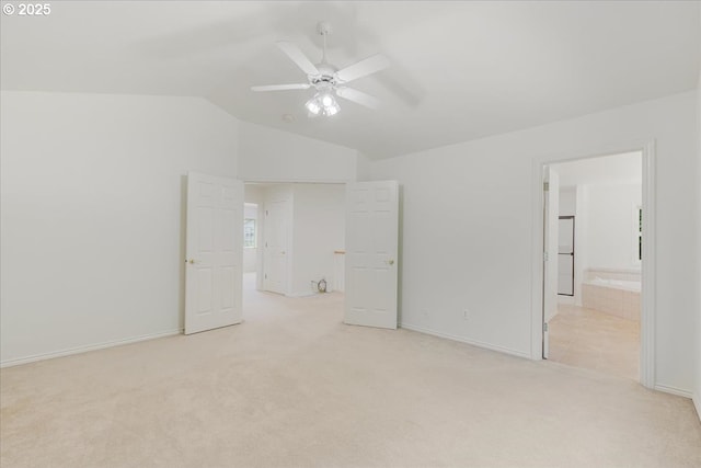 18169 SW Shady Meadow Ct, Beaverton, OR 97007 - unfurnished bedroom featuring light colored carpet, vaulted ceiling, baseboards, ensuite bath, and a ceiling fan
