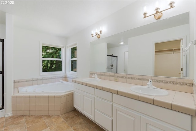 18169 SW Shady Meadow Ct, Beaverton, OR 97007 - full bath featuring double vanity, a stall shower, a bath, and stone finish floors