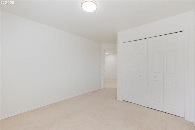 18169 SW Shady Meadow Ct, Beaverton, OR 97007 - unfurnished bedroom featuring light colored carpet, a closet, and baseboards