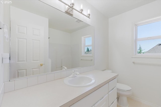 18169 SW Shady Meadow Ct, Beaverton, OR 97007 - bathroom with toilet, vanity, a shower, and baseboards