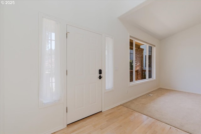 18169 SW Shady Meadow Ct, Beaverton, OR 97007 - entrance foyer featuring baseboards, light wood-type flooring, and light carpet
