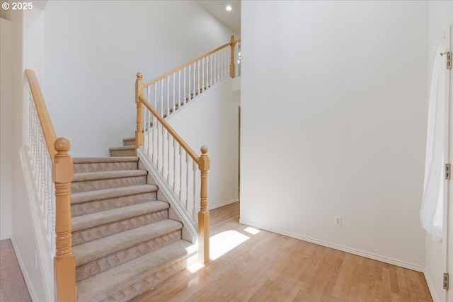 18169 SW Shady Meadow Ct, Beaverton, OR 97007 - stairs with wood finished floors, baseboards, and recessed lighting