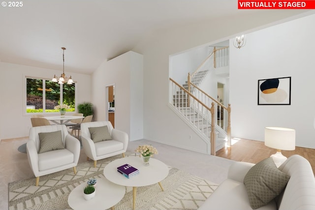18169 SW Shady Meadow Ct, Beaverton, OR 97007 - carpeted living area with a chandelier, stairway, vaulted ceiling, and baseboards