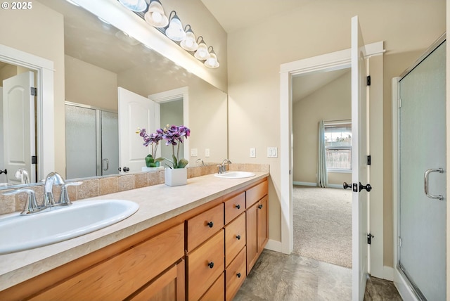 bathroom with vanity, an enclosed shower, and lofted ceiling