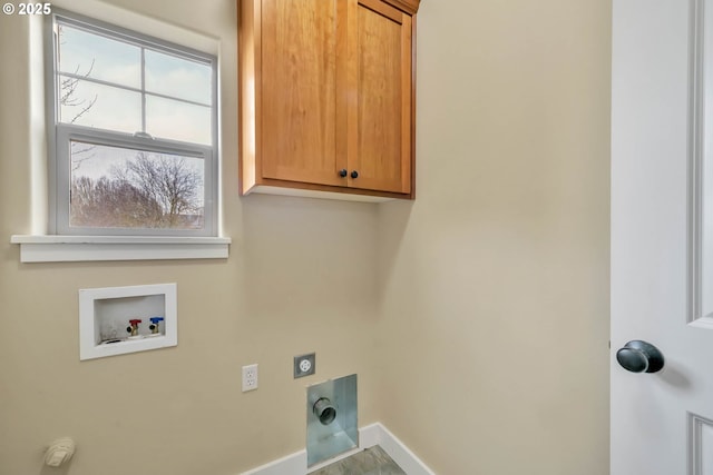 clothes washing area with cabinets, electric dryer hookup, a healthy amount of sunlight, and washer hookup