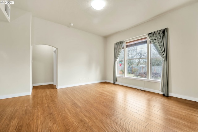 empty room with light hardwood / wood-style floors