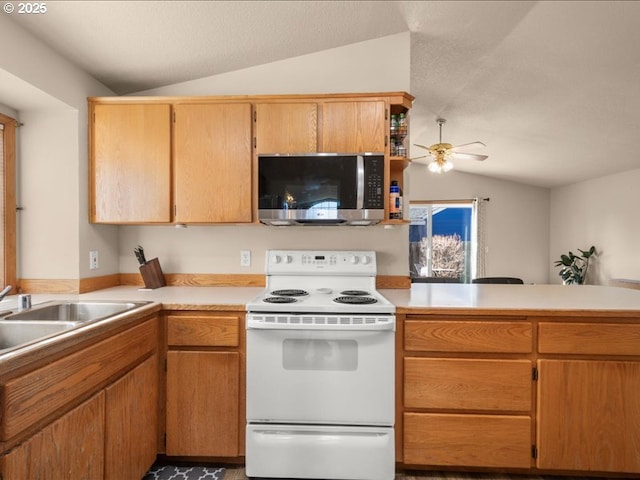 kitchen featuring lofted ceiling, sink, electric range, ceiling fan, and kitchen peninsula