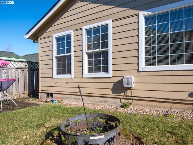 view of side of property featuring a yard