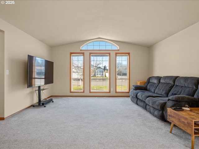 living room featuring lofted ceiling and light carpet