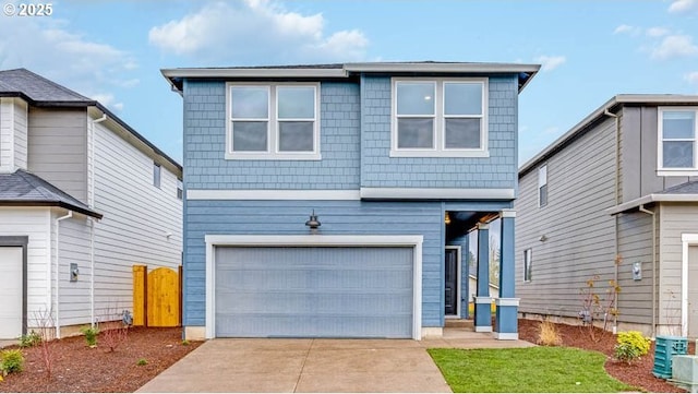 traditional home with concrete driveway and an attached garage