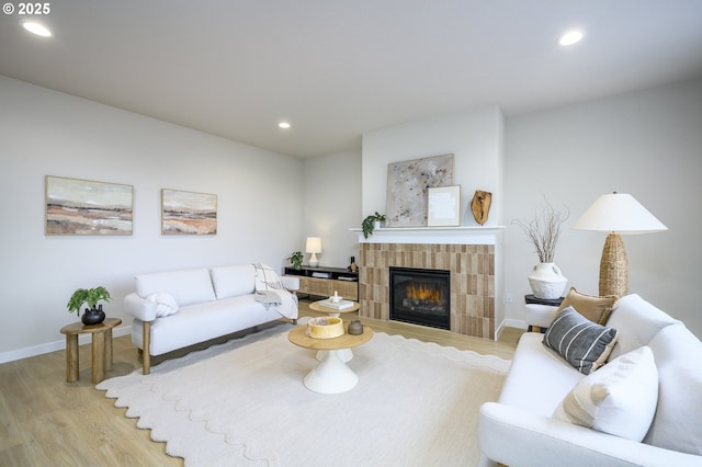 17269 SW Atfalati Ln Unit 36, Sherwood, OR 97140 - living room featuring light wood-style floors, a fireplace, and recessed lighting