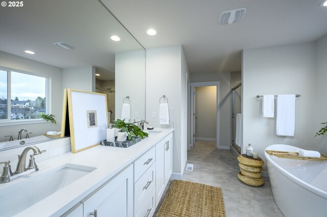 17269 SW Atfalati Ln Unit 36, Sherwood, OR 97140 - bathroom with a stall shower, double vanity, a freestanding bath, and recessed lighting