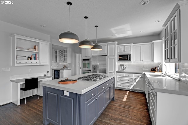 1811 NW Rosefinch Ln, Portland, OR 97229 - kitchen featuring stainless steel appliances, wine cooler, white cabinetry, dark wood-style floors, and decorative backsplash