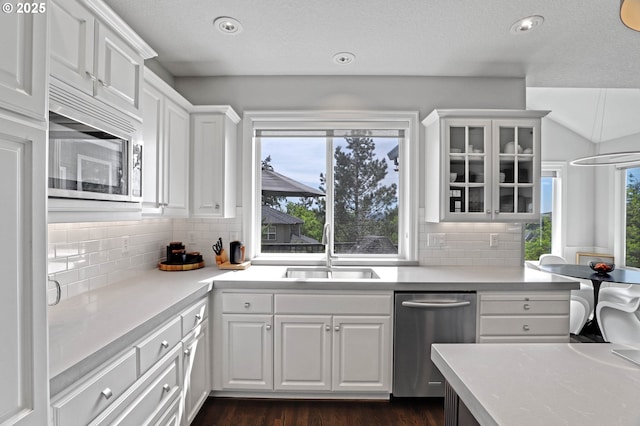1811 NW Rosefinch Ln, Portland, OR 97229 - kitchen featuring stainless steel appliances, a sink, white cabinetry, glass insert cabinets, and recessed lighting