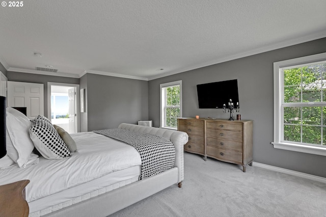1811 NW Rosefinch Ln, Portland, OR 97229 - bedroom featuring crown molding, a textured ceiling, light colored carpet, and baseboards